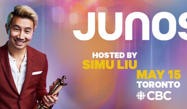 simu liu holding a Juno