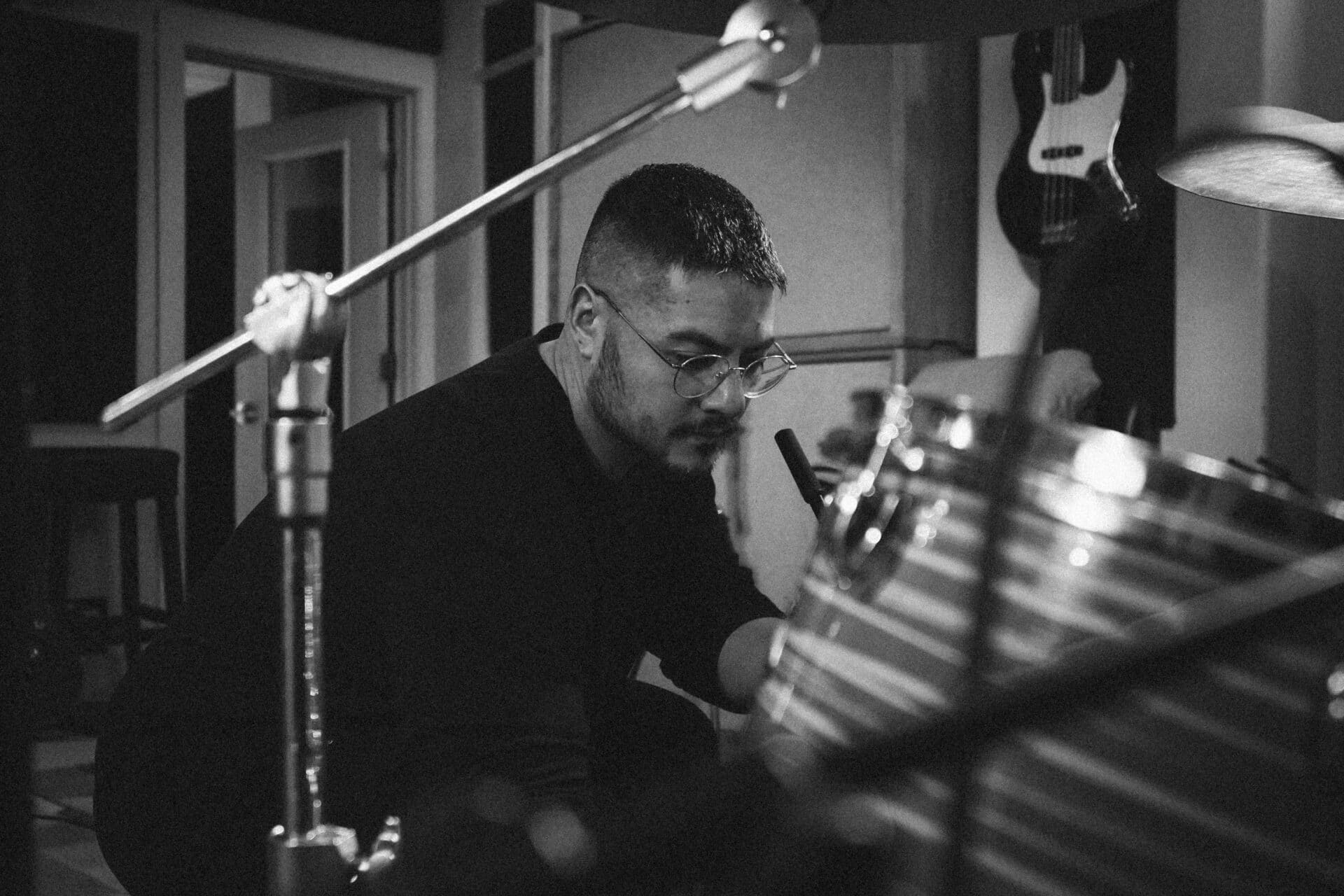 A black and white photo of Walt Jeworski in the studio.